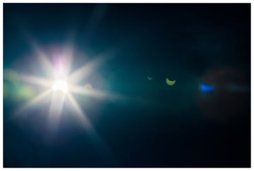 solar eclipse lens flare