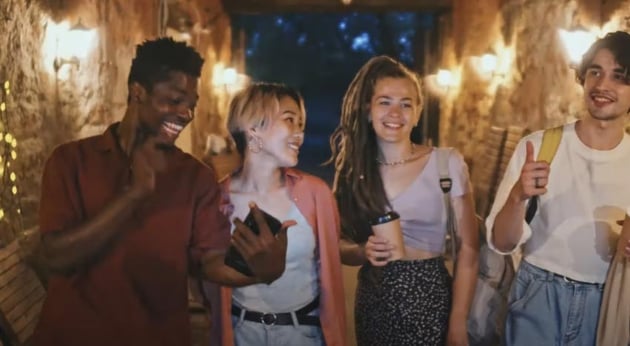 Group of Young Diverse Friends Walking at Night