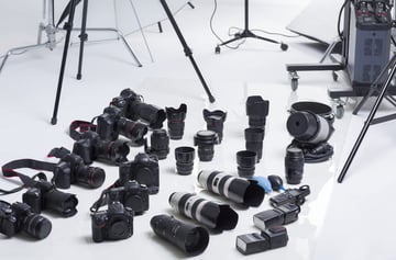 Many cameras and lenses in studio
