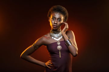 Beautiful afro girl with drawings on skin