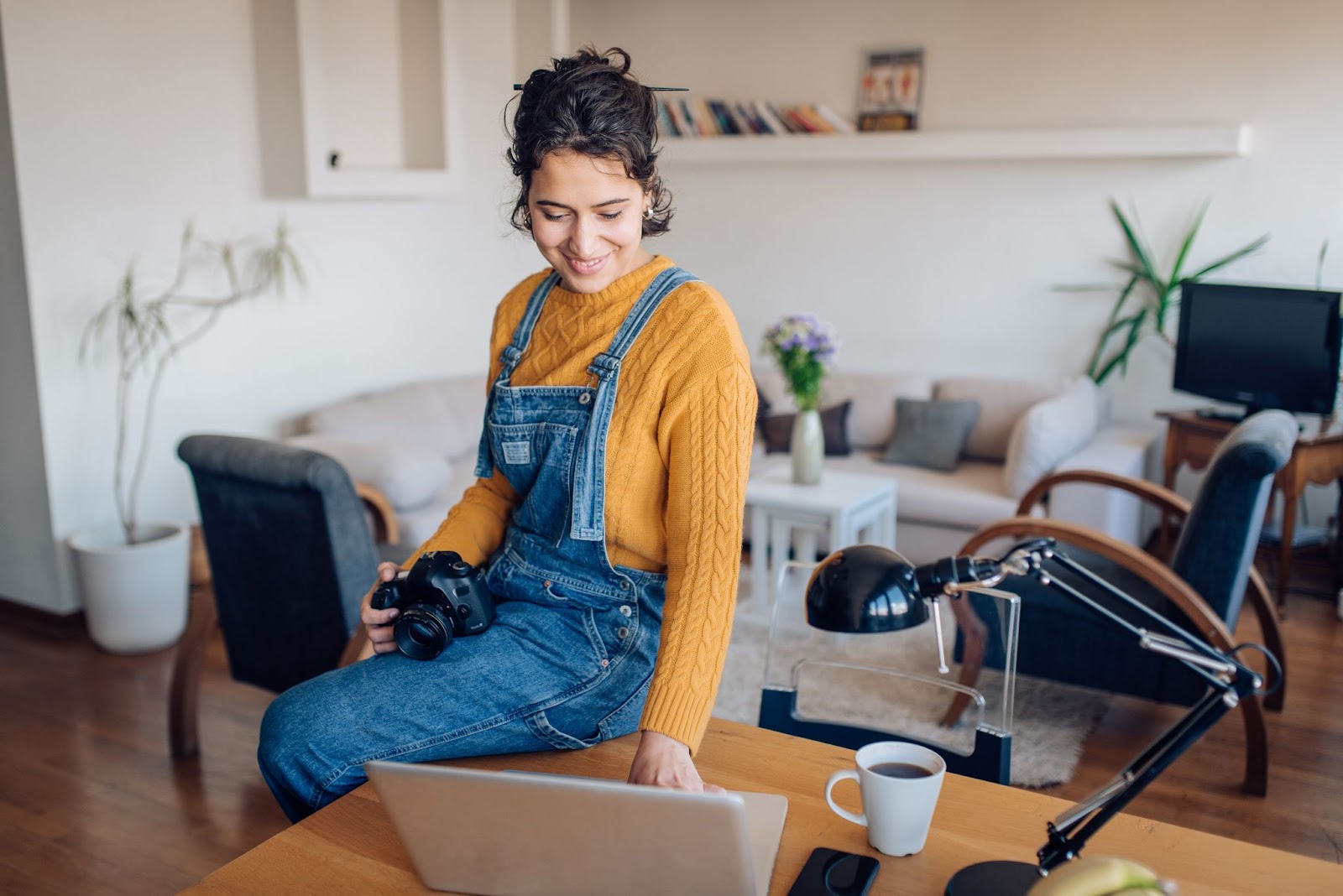 Girl with camera on laptop